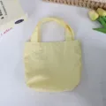 Solid yellow nylon mini tote bag, lightweight casual handbag and practical lunch bag detail. - 21*6*27cm / Yellow