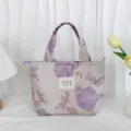 Vintage floral jacquard tote bag detail, elegant purple fabric with texture, close-up view. - Light Purple Rose