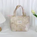 Vintage embossed floral jacquard lunch bag handbag detail view, elegant design, daily storage. - Pink Gold Embossed Flower
