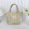 Vintage embossed jacquard bento bag detail, exquisite fabric pattern and sturdy handle design. - Glittering Gold Corn Poppy
