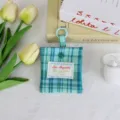 Gezuite mini-muntbeurs en koptelefoonhoesje met ophangring voor dagelijks draagbaar gebruik. - Cadmiumgroene Ruit
