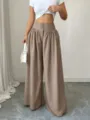 High waist wide leg trousers detailed view, showcasing the elegant drape and three-button waist. - S / Khaki
