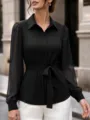 Close-up details of black pinstripe sheer sleeve blouse with waist tie for women fashion. - S / Black