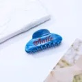 Retro blaue marmorierte Acetat Haarklammer mit roten Strass Smile Buchstaben für Damen. - Dunkelblau