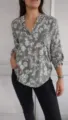 Details view of the casual long-sleeve floral print blouse featuring a chic sequin pocket. - S / Tops / Green