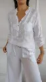 Close-up detail of the women casual long sleeve floral print shirt with sequin pocket design. - S / Tops / White