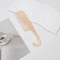 Portable wide tooth hair comb with hook handle, minimalist beige glossy styling tool. - Off White