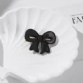 Elegante schwarze glänzende Schleifen Haarklammer für Damen, stilvoller Azetat Entenschnabel. - Schwarz