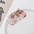 Cute cat ear acetate hair comb in pink tortoiseshell design, compact and anti-static styling tool. - Peach