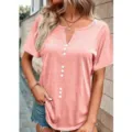 Outdoor detail shot of pink short sleeve V-neck button-down top worn by model against wall. - S / Tops / Pink