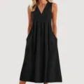 Closeup detail of the black V-neck sleeveless maxi dress, showing soft fabric and side pockets. - S / Black