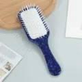 Blue tortoise shell paddle hairbrush with soft cushion and anti-static bristles for daily use. - Blue
