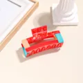 Bunte Acetat Haarklammer für Damen, geometrisch gestaltete Haarkralle für elegantes Styling. - Rot