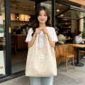 Casual canvas shopper tas voor dames, stijlvolle schoudertas met strik borduurwerk en grote capaciteit. - Abrikoos Blauwe Strik