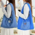 Detail view of the reversible retro plaid tote shoulder bag showing double-sided design. - Blue Plaid