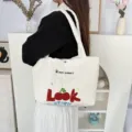 Detailed view of the quilted tote bag featuring cute cherry embroidery and heart quilted texture. - Quilted Heart Cherry Look / White