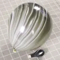 Macro detail of thick black and white agate marble patterned latex balloon on checkered background - Black Agate Marble Pattern