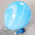 Detail showing light blue and white agate marble pattern on thickened latex balloon - Blue Agate Style