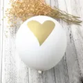 Elegant white thickened latex balloon featuring a metallic golden heart print design - White with Gold Heart Print Style