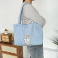 Light blue quilted heart tote bag, cute cartoon duck embroidery, casual shoulder handbag. - Quilted Heart Happy Duck / Blue