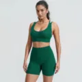 Detailed view of the dark green ribbed sports bra and high-waisted fitness shorts set. - S / Top And Bottom / Christmas Green