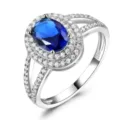 Attraktiver 925 Silberring mit blauem Zirkonia und funkelnden kleinen Steinen im Doppelhalo. - Größe 5 / Blau