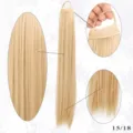 Synthetic long straight ponytail extension detail view showing hair texture and elastic band. - Honey & Ash Blonde Mix (15/18)
