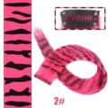 Clip-in synthetic hair extensions pink leopard print highlight hair piece detail view - Peach Red Leopard