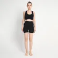 Seamless activewear yoga set in black, featuring a sports bra and high-waist shorts. - S / Black