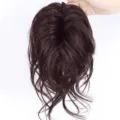 Detailed view of synthetic hair bun claw clip extension in messy dark brown ponytail style. - Dark Brown