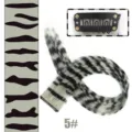 Leopard print clip-in hair extension detail view showing color pattern and secure metal clip. - Silver Gray Leopard