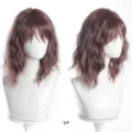 Detail view of short wavy bob wig with bangs and gradient color, featuring natural parting. - Auburn Gradient