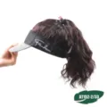 Detail view of the fashion sun visor hat with curly hair extension and houndstooth brim. - Black Hat Left Letter Dark Brown Curly Hair