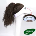 Detail view of the brown curly hair extension attached to a white baseball cap, stylish. - White Hat Middle Letter Cool Brown Curly Hair