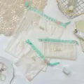 Λεπτομέρεια τσάντας οργάντζας με λεπτό κέντημα λουλουδιών και ωραίο κορδόνι. - Μικρό (14*15) / Μπεζ