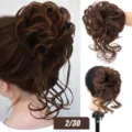 Synthetic messy hair bun detailed view, fluffy curly updo hairpiece with wispy ends. - Color Code 2/30 / Black Brown