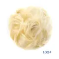 Detailed shot of the fluffy messy synthetic hair bun scrunchie in light blonde color. - Cream Style (102)