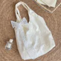 Cream white floral embroidered canvas tote bag with delicate lace bow for daily wear. - Vest Bag (With Flower Accessory)