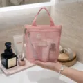 Pink mesh cosmetic bag detail showing zipper closure and transparent breathable material storage. - L / Pink