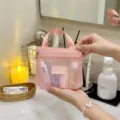 Pink mesh cosmetic bag detail shot, portable zipper makeup pouch and travel toiletry organizer. - S / Pink