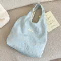 Light blue embroidered canvas shoulder bag detail, floral pattern texture underarm tote bag. - Basic Style / Light Blue