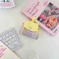 Yellow and purple plaid mini snap pouch detail shot, perfect for portable earphone storage. - Purple Grid