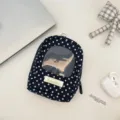 Polka dot mini backpack doll storage bag with clear window and zipper closure detail view. - Black