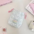 Portable quilted heart storage pouch with pink drawstring, ideal for cameras and cosmetics. - Quilted Star Pattern Blue