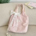 Pink polka dot canvas tote bag with elegant white lace bow detail for daily casual use. - White Flower Decorative Style / Light Pink