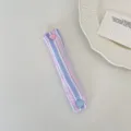 Cute striped cable organizer with heart button, portable earphone cord storage strap for desk. - Pink Blue Seersucker