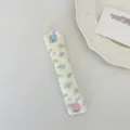 Floral corduroy earphone cable organizer strap with cute heart and round button design. - Corduroy Peach Blossom Blue