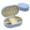 Light blue oval PU leather jewelry box, compact travel storage case for rings and necklaces. - 14.5x9.5x4.5cm / Blue