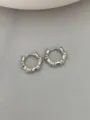 Detailed close-up of silver bamboo hoop earrings, minimalist metal jewelry design. - Bamboo Joint Style - White (Medium)