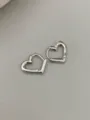Detailed shot of silver heart hoop earrings, minimal and elegant design for daily wear. - Heart Style - White (Small)